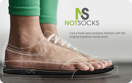 Transparent shoe with a foot wearing green socks, featuring the 'NotSocks' brand.