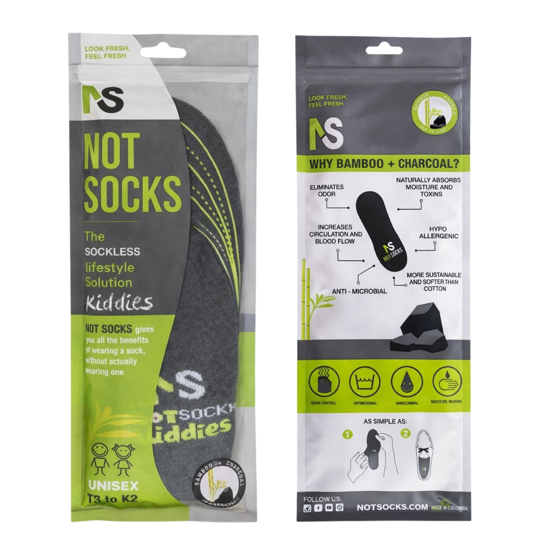 Front and back packaging of NOT SOCKS kids' bamboo charcoal inserts, highlighting odor control and antimicrobial benefits for sizes T3 to K2.
